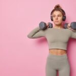Woman holding dumbbells