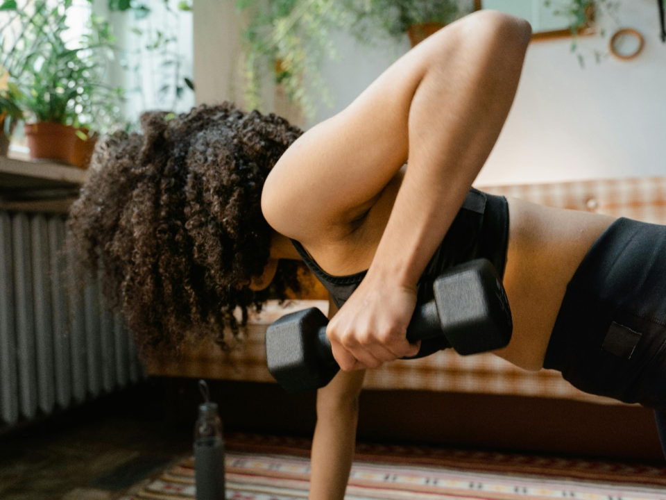 Woman doing strength training at home