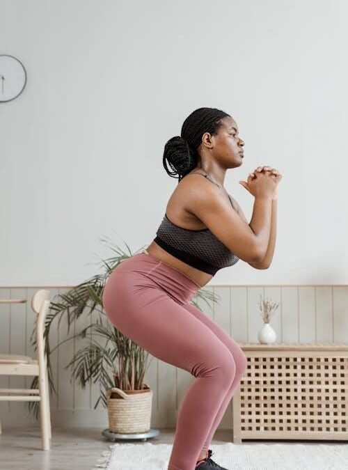 An image of a woman doing squats at home
