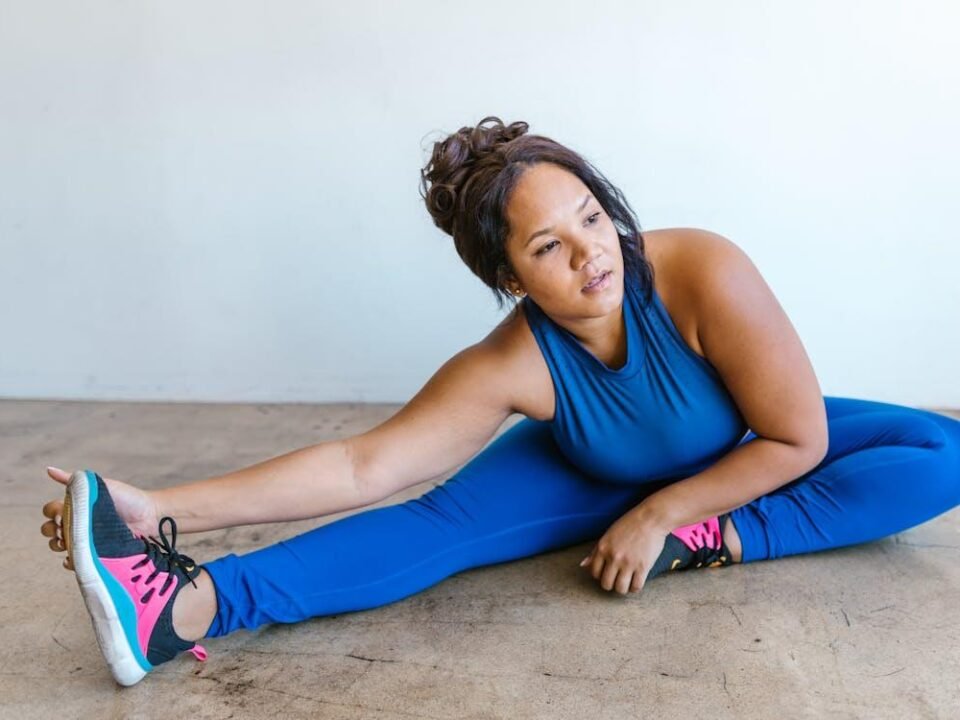 An image of a woman warming up before an online workout class
