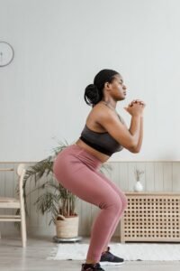 An image of a woman doing squats
